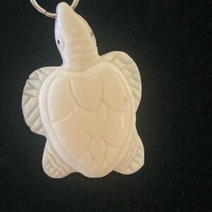 Turtle, carved bone, pendant on adjustable cord